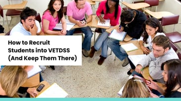 Group of diverse students sitting in a classroom, collaborating and taking notes, representing VETDSS recruitment and retention.