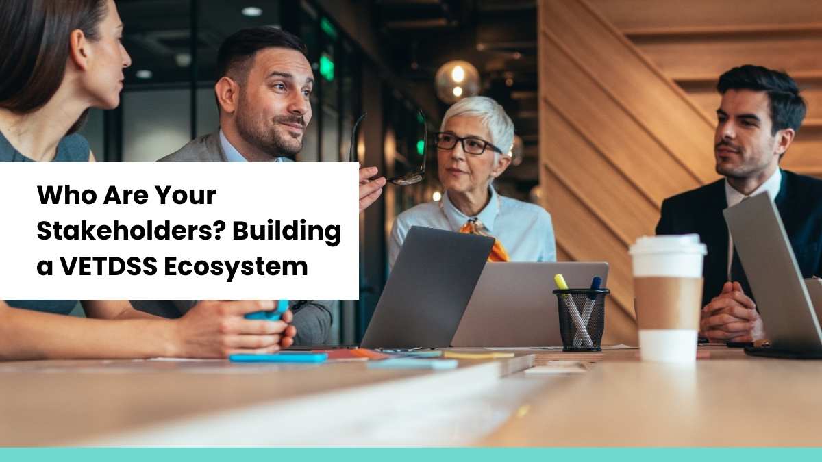 Business professionals collaborating in a modern office, representing stakeholder engagement and ecosystem building for VETDSS initiatives.